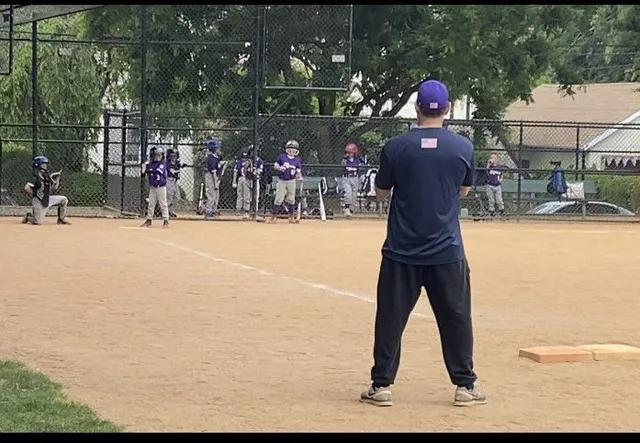 Biagio Maffettone coaching youth baseball team practice on field